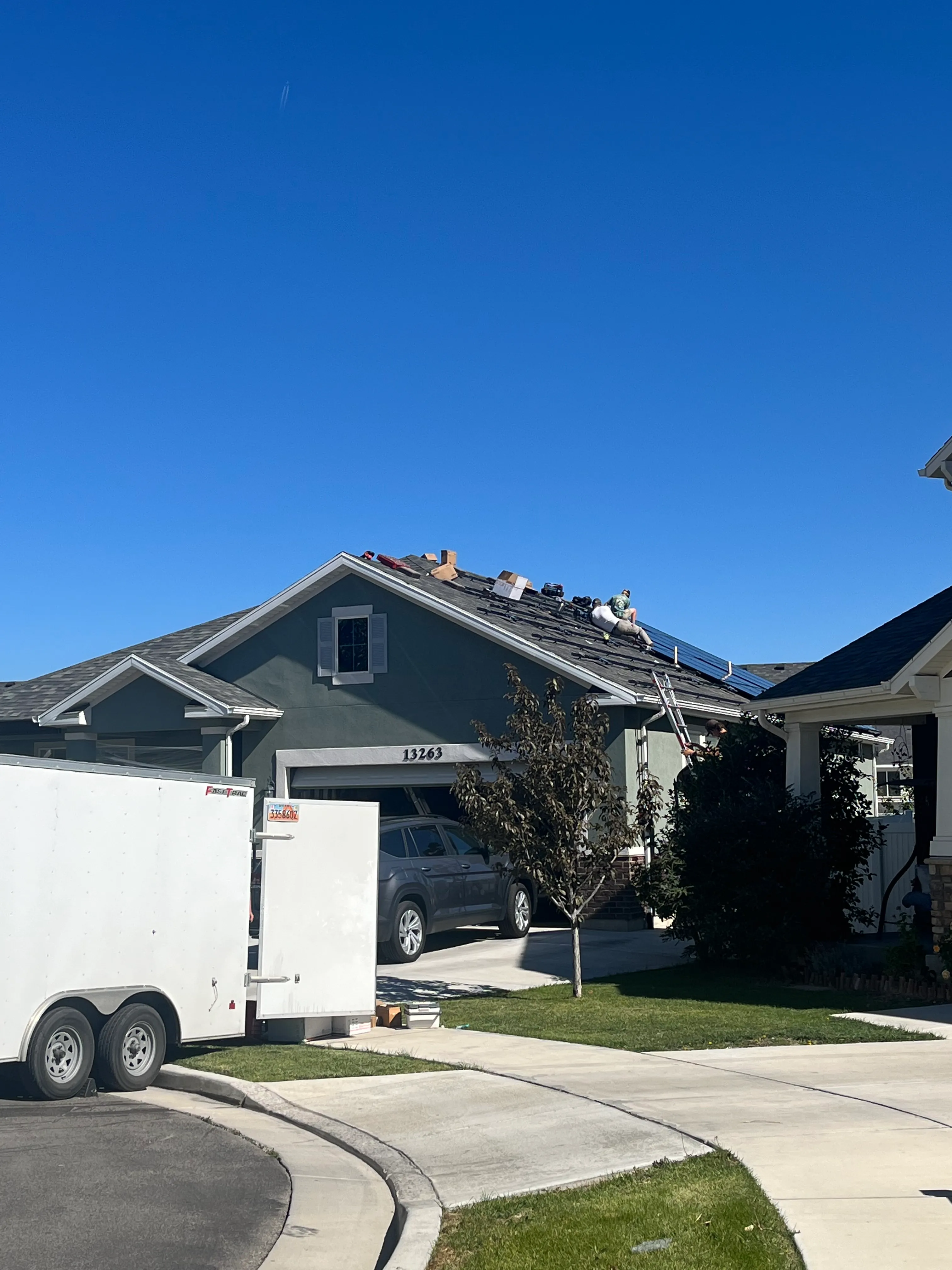Simple Modern Energy crew installing solar panels on a roof