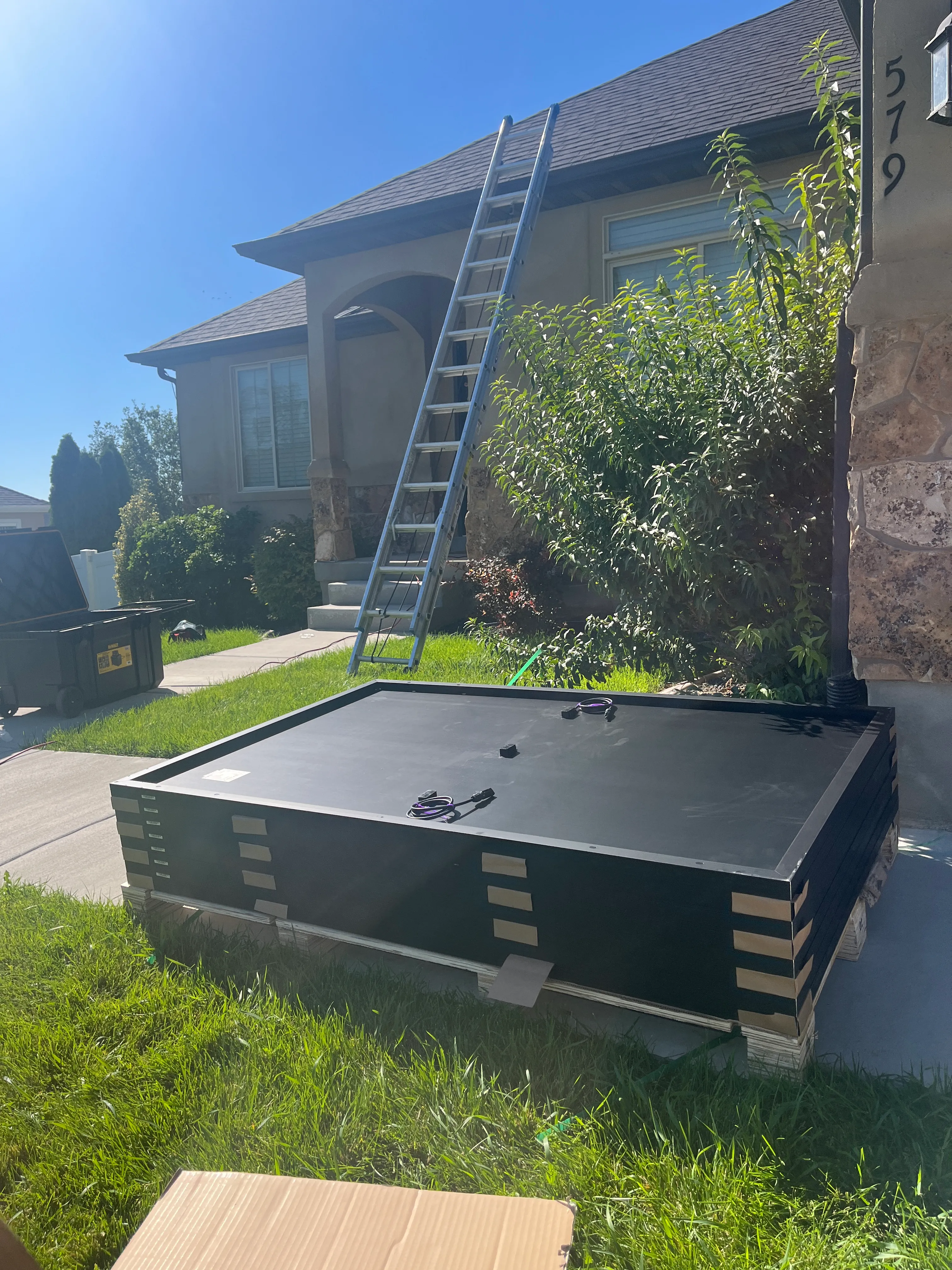 Solar panels staged and ready before a Simple Modern Energy installation