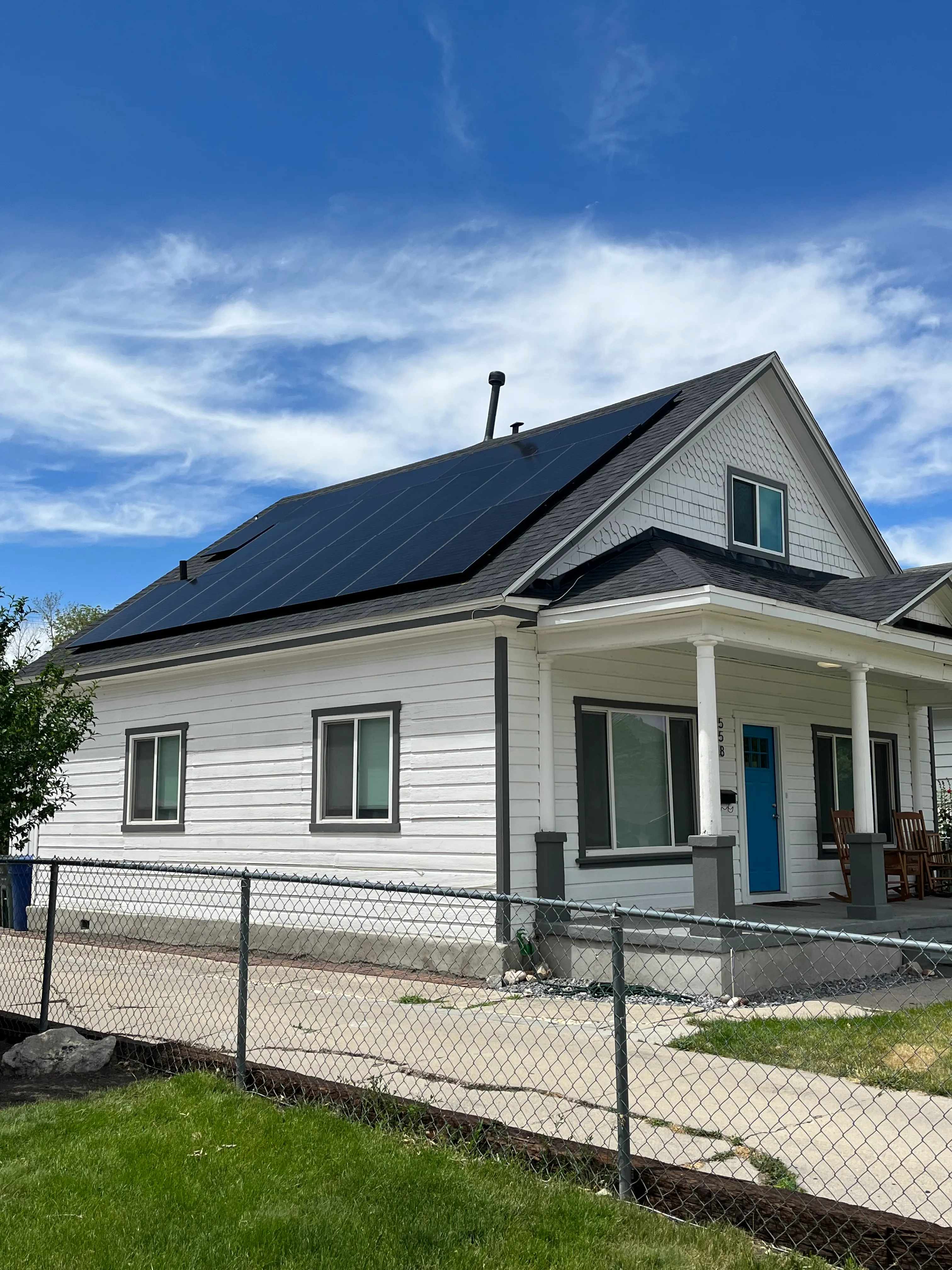 Completed residential solar panel installation under a clear Utah sky